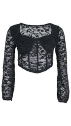 Top Bralette de encaje en color negro, con cuerpo corto tipo corsé, bajo en pico y mangas largas transparentes.